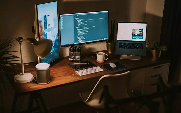 A room with monitors of coding and programming