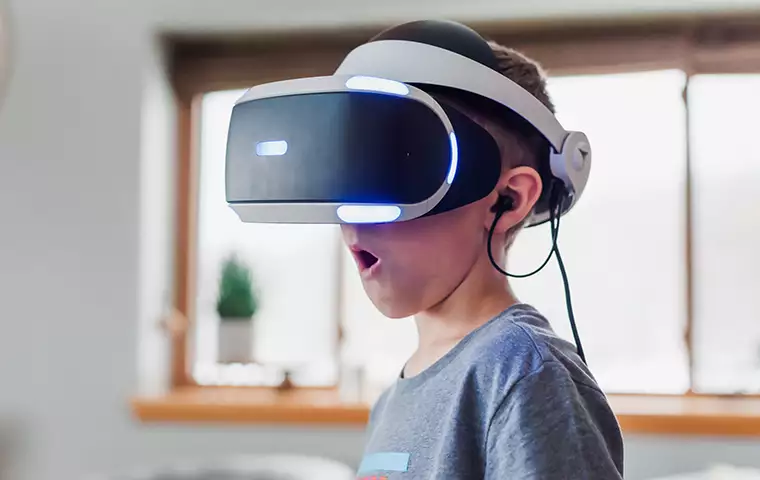 A kid is using VR headset