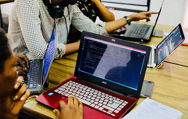 A group of developers is working with their desktop on front end languages