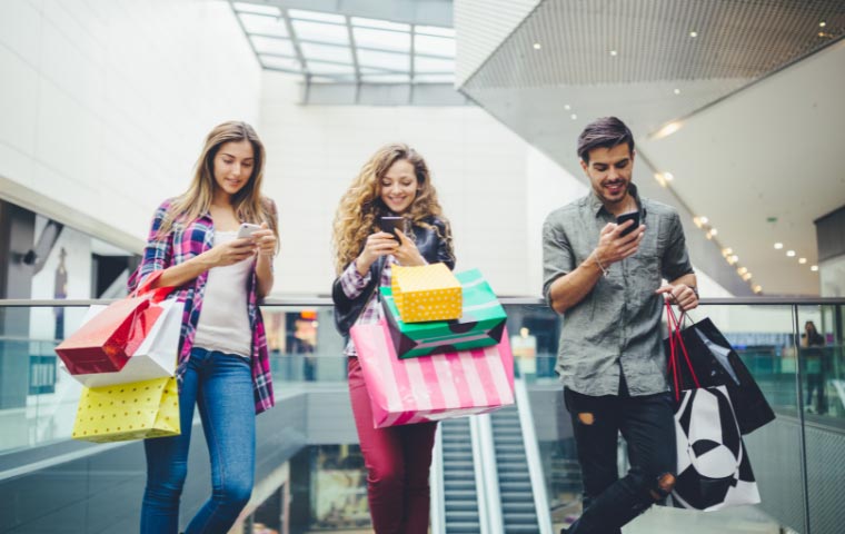 a photo of 3 people shopping in a shopping mall